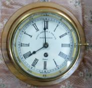 Brass cased Ships Bulkhead Clock by Henry Browne & Sons: mounted, diameter of dial 14.5cm