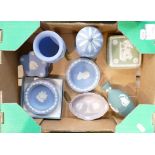 A collection of Wedgwood items to include: Teal Vase, Lilac pin tray, blue lidded boxes & pin