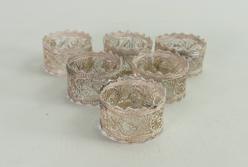 Silver coloured metal set of six napkin rings: Tested as probably low grade silver, but hard to