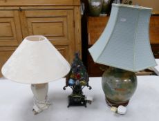 Two ceramic lamp bases: with shades together with a glass and metal table lamp