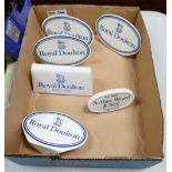 A collection of Royal Doulton Arthur Woods Ceramic Counter Top Advertising Name Plaques(6)
