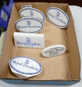 A collection of Royal Doulton Arthur Woods Ceramic Counter Top Advertising Name Plaques(6)