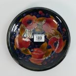 Moorcroft shallow dish in the pomegranate pattern: 22cm wide, hairline from edge to centre.