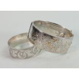 Two silver hallmarked bangles: The larger is Chester hallmarked for 1930, and with gold or gilt
