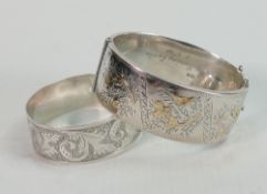 Two silver hallmarked bangles: The larger is Chester hallmarked for 1930, and with gold or gilt
