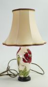 Moorcroft table lamp with shade: Height to top of ceramic base, excluding brass fitting 23.5cm.