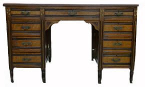 Early 20th century Aesthetic carved Walnut 9 drawer Knee Hole desk: With vinyl top, length 121cm,