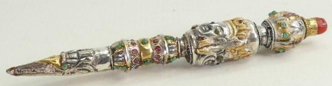 Phurba ceremonial dagger: Silver coloured metal with gilt decoration, set with various gemstones.