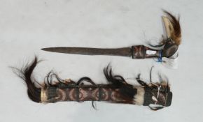 Antique Dayak Borneo head hunters sword: and sheath adorned with hair & teeth, L58cm.