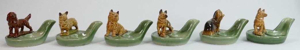 A collection of Wade porcelain dog pipe stands: Six pieces. (6)