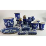 A mixed collection of dip blue Wedgwood items to include: Vases, planter, sugar sifter, lidded boxes