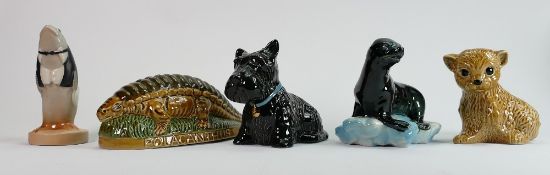 A collection of Wade figures: Including Polacanthus money bank, Fish footman, Seal on glacier,