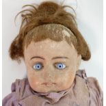 19th century Bisque headed doll: Fixed eyes with horse hair filled body and pottery legs & feet,