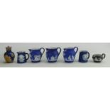 A collection of Wedgwood dip blue items to include: Pepper pot, jugs etc.