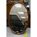 Large oval inlaid Edwardian wall mirror: Height at longest 77cm.