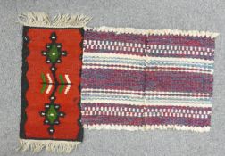 Three small Kilim rugs: Two measuring 33cm x 23cm, and one 41cm x 20cm. (3)