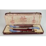 Wedgwood handled cutlery by Philip Ashberry of Sheffield: Cased carving set.