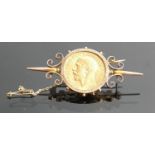 Gold Full Sovereign dated 1914 :mounted in yellow metal ornate brooch,11.9g.