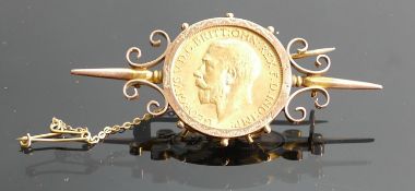 Gold Full Sovereign dated 1914 :mounted in yellow metal ornate brooch,11.9g.