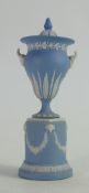 19th century light blue small rams head handled vase and cover: Height on stand 17cm.