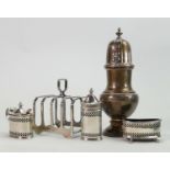 Hallmarked silver castor toast rack and cruet set: Large silver castor 17cm small dent to body