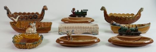 A collection of Wade porcelain dishes: Comprising 2 trains, man in a boat, Viking ships, Seagull