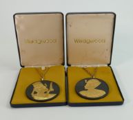 Wedgwood pair of round black Basalt gilded Egyptian pendants: With yellow metal necklaces, both