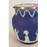 A collection of early 20th century dip blue Wedgwood items to include: Vases, jugs, condiment