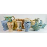 A collection of Wade Art Deco pottery: Including Budgerigar jug and several smaller jugs, baskets