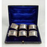 Set of 6 hallmarked silver napkin rings cased: Matching hallmarks for Birmingham 1910, numbered
