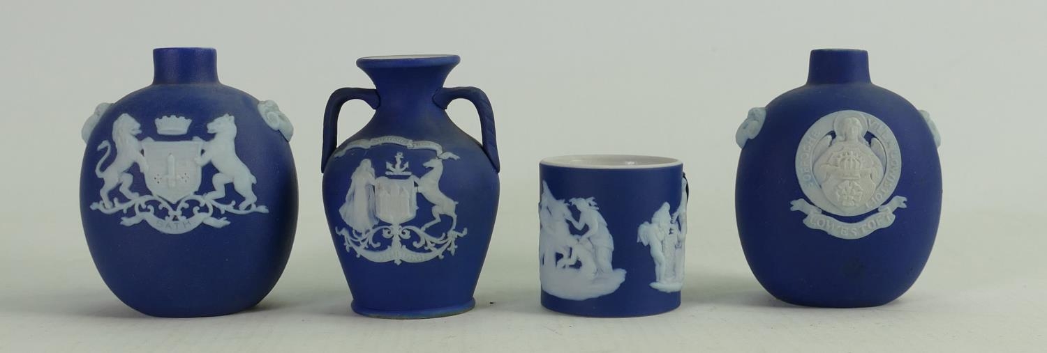 A collection of Wedgwood dip blue miniature items to include: Crested vases & tankard.