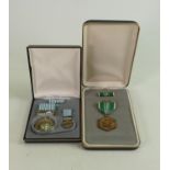 Two boxed US Army military medals: comprising Commendation For Military Merit and United Nations