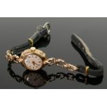 9ct ladies Rotary cocktail watch :with gold and leather strap, 11.9g.
