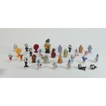 A collection of miniature Wade figures: Including sets of Rupert Bear, Snowman, Korky the cat etc.