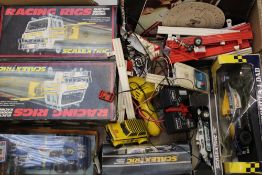 A collection of Scalextric vehicles: controllers, track etc