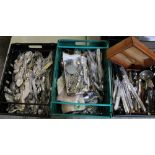 A large quantity of cutlery: knives, forks, ladels, cake serving knives etc (3 trays).