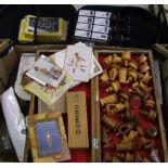 A mixed collection of items: wooden chess set and board, healing cards, greeting cards, car cleaning