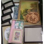 A mixed collection of items: picture frames, print etc.