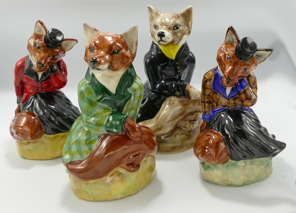 Set of Four Staffordshire Pottery Foxes: all in sample colour ways, height of tallest 20cm(4)