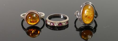 Three Silver Rings: two with amber stones