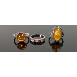 Three Silver Rings: two with amber stones