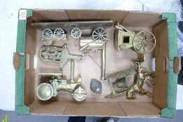 A collection of heavy brass ornaments to include: steam engines, horse & carriage, ornamental bell