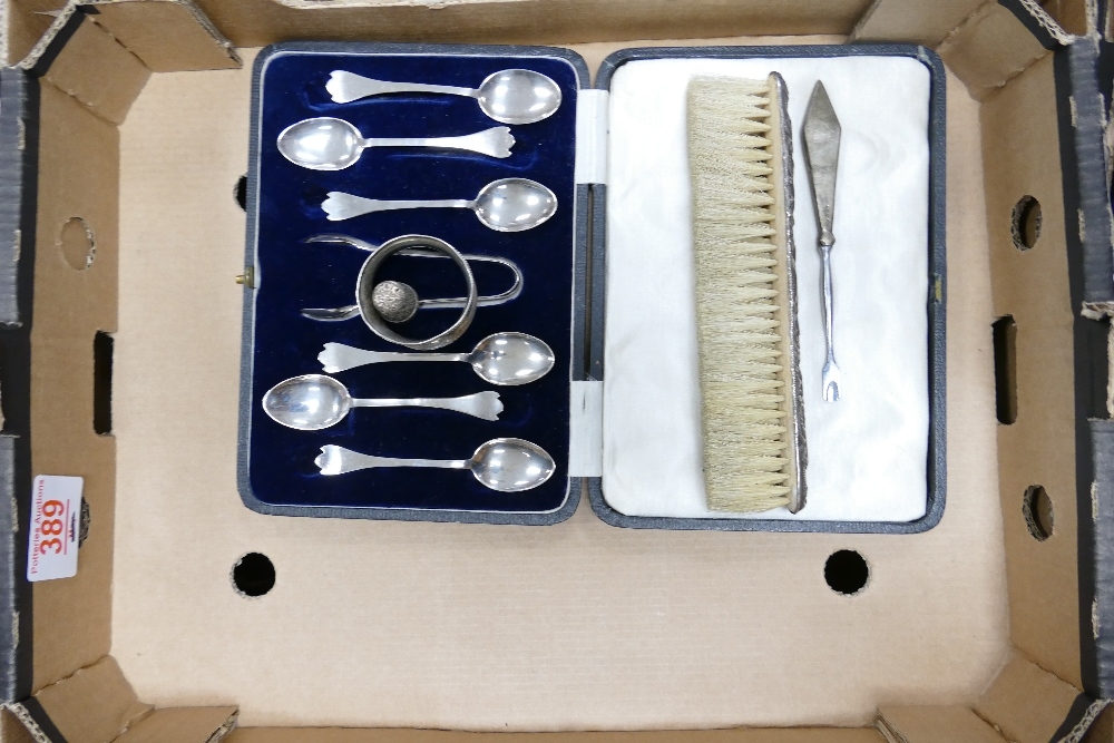 A mixed collection of items to include: silver spoon set, napkin ring, thimble etc