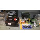 A mixed collection of automotive parts: brake disks, filters, nitro battery, inner tube, spark plugs