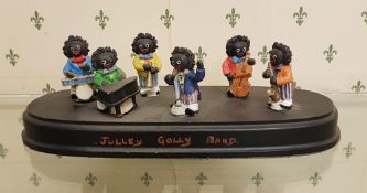 A mounted set of 6 jazz band 'Golly' figures: 'Jolley Golly Band', length of base 25cm.