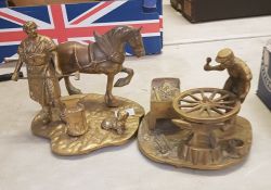 2 brass figural groups: depicting a farrier and a wheelwright (2).