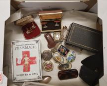 A mixed collection of items to include: small enameled pill boxes, cased cufflinks, vintage style