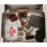 A mixed collection of items to include: small enameled pill boxes, cased cufflinks, vintage style