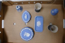 A collection of Wedgwood Items to include: black dip spill vases, blue jasper lidded boxes & bells
