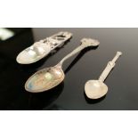 Three interesting hallmarked silver spoons: one spoon decorated with a bird in foliage, Iona spoon
